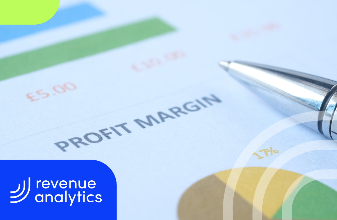 Close-up of a financial report displaying the words “PROFIT MARGIN” with charts and a silver pen in view