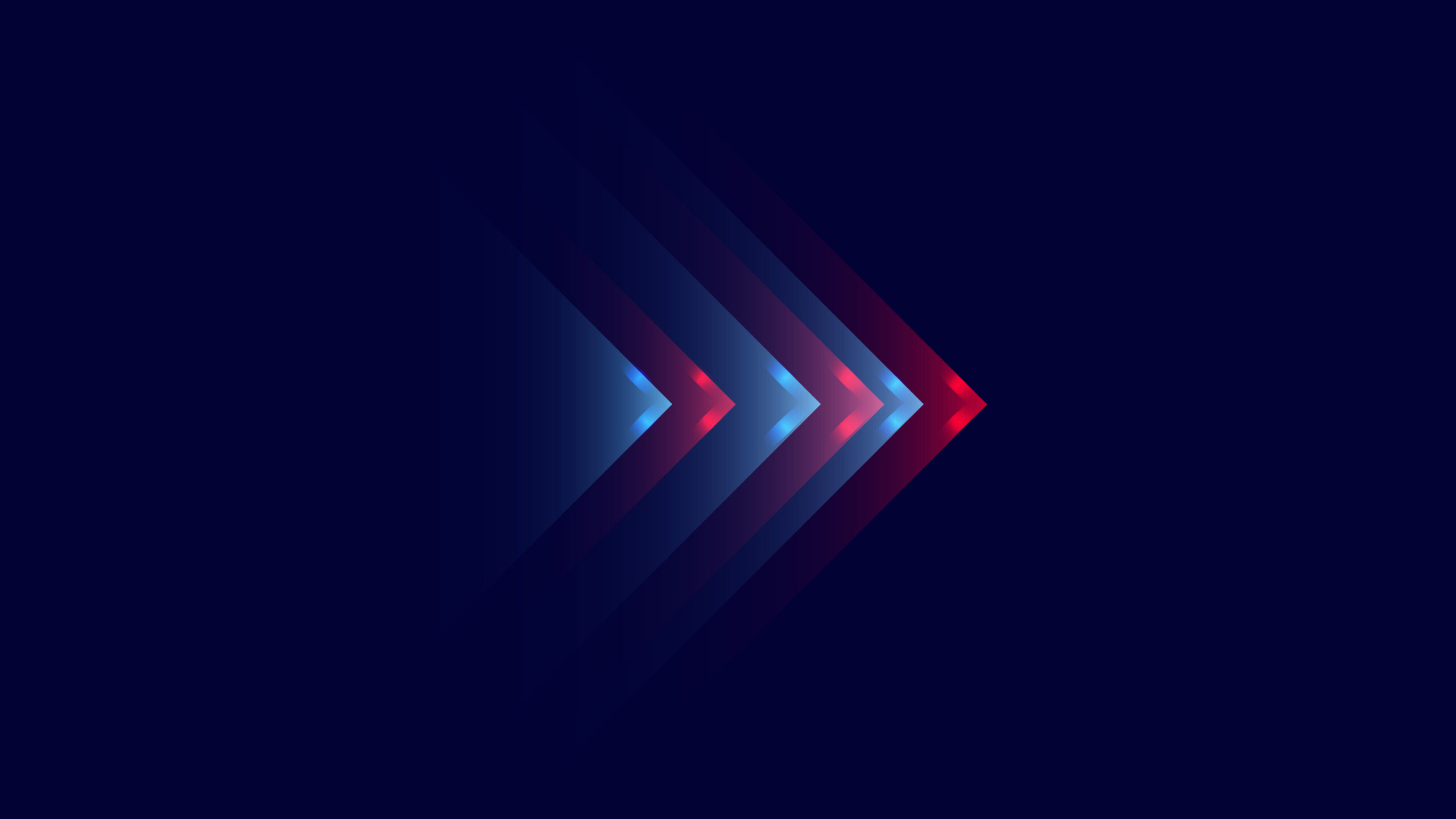 A series of overlapping translucent arrows pointing to the right, transitioning from blue to red against a dark blue background.